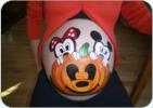 A mousey Halloween Painting on a pregnant belly